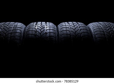 Car tires isolated on black background