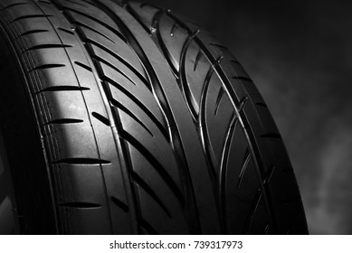 Car tires on a dark background. Summer car tires.