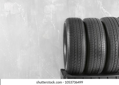 Car tires on grey background