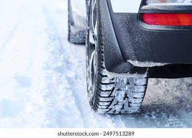 Car tires on snowy road close up view - Powered by Shutterstock