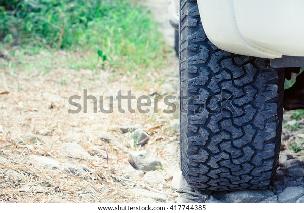 Car tires on summer
road