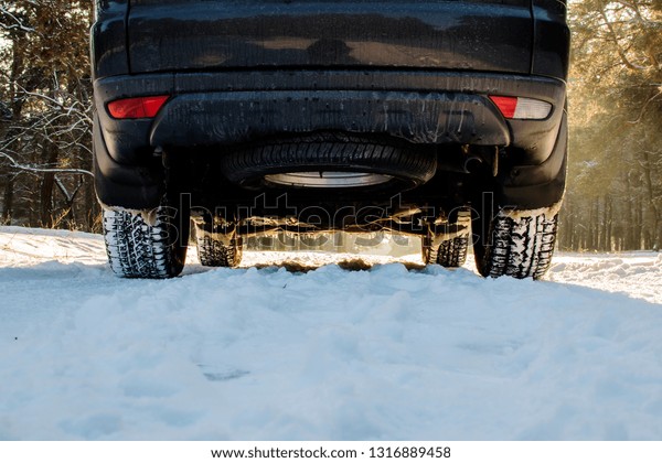 Car tires on winter\
road