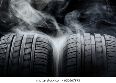 Car Tires And Smoke On Black Background