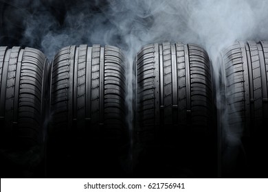 Car Tires And Smoke On Black Background