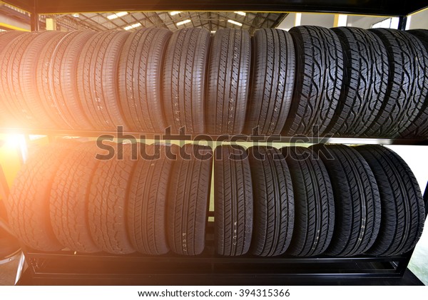 Car tires at warehouse\
and sun rays.