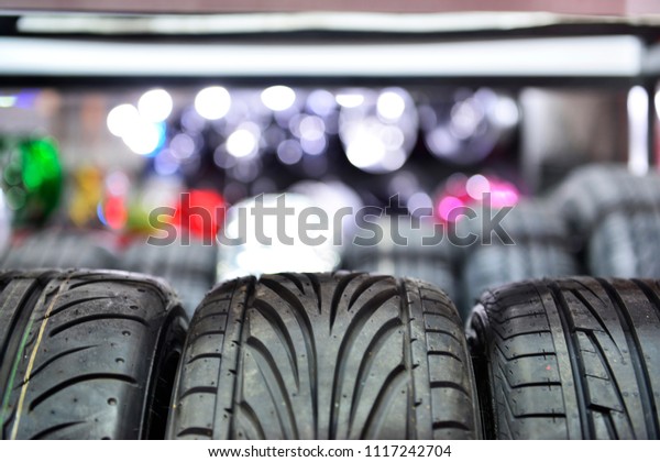 Car tires at warehouse\
in tire store.