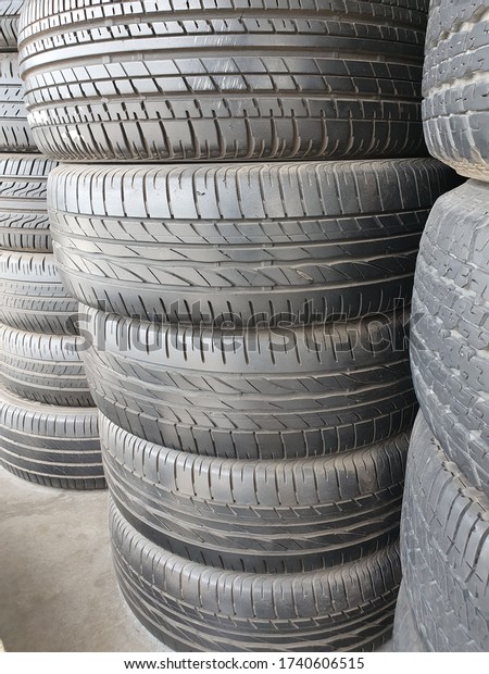 Car tires at warehouse in tire store. Tire\
textured for background.\
rubber