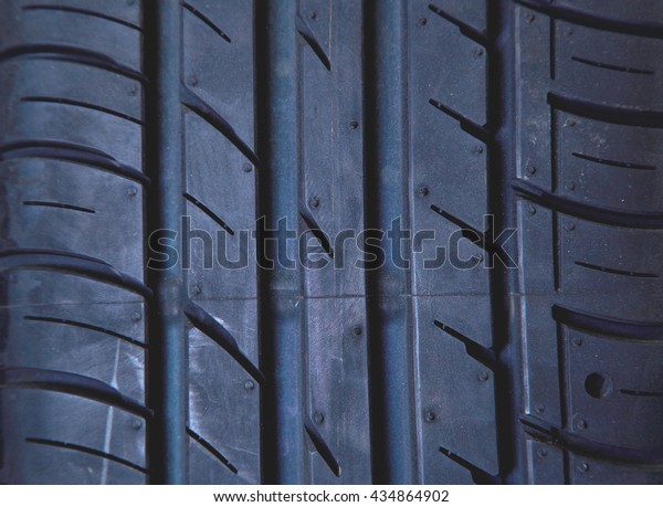 Car tires at warehouse\
in tire store