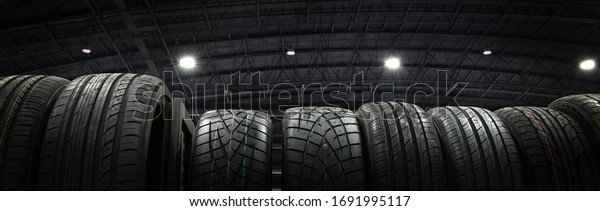 Car tires at warehouse in tire store.black and white\
tone,banner side