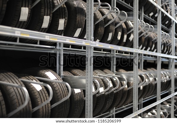 Car tires
and wheels at warehouse in tire
store.