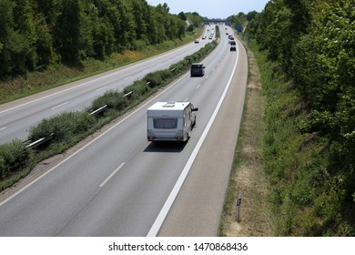 Car Towing Caravan On European Motorway
