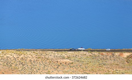 Car Towing A Trailer With A Boat.