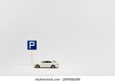 Car Toy With Car Parking Traffic Sign On White Background, Valet Parking Service 