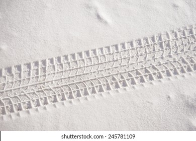 Car track in fresh snow