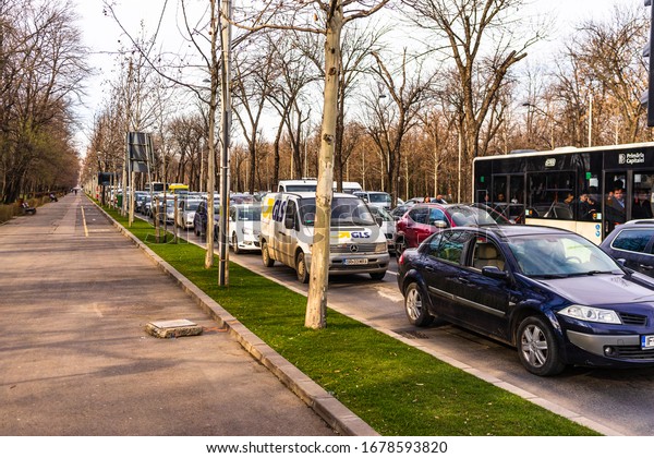 Car traffic in downtown area of Bucharest.\
Car pollution, traffic jam in the morning and evening in the\
capital city of Bucharest, Romania,\
2020