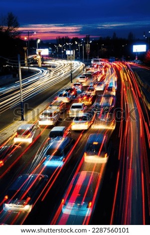 Car traffic light at night city highway.