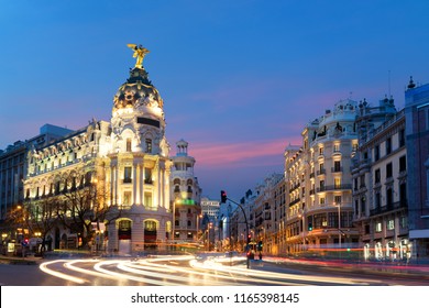 Car And Traffic Lights On Gran Via Street, Main Shopping Street In Madrid At Night. Spain, Europe. Landscape And Culture Travel, Or Historical Building And Sightseeing Concept