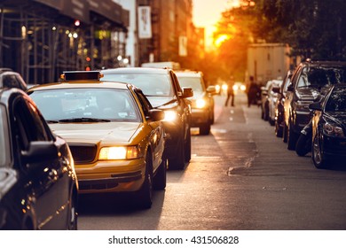 Car Traffic On New York City Street At Sunset Time