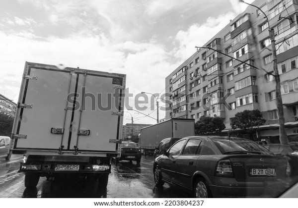 Car traffic, pollution, traffic jam in Bucharest,\
Romania, 2022