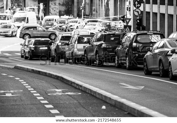 Car traffic, pollution, traffic jam city downtown\
Bucharest, Romania, 2022