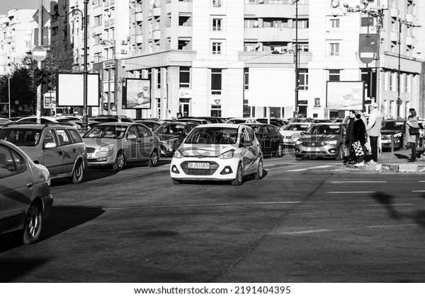 Car traffic, pollution, traffic jam city downtown\
Bucharest, Romania, 2022