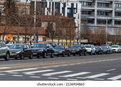 Car traffic at rush hour in downtown area of the city. Car pollution, traffic jam in Bucharest, Romania, 2022