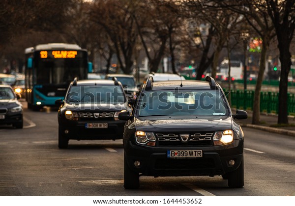 Car traffic at rush hour in\
downtown area of the city. Car pollution, traffic jam in the\
morning and evening in the capital city of Bucharest, Romania,\
2020
