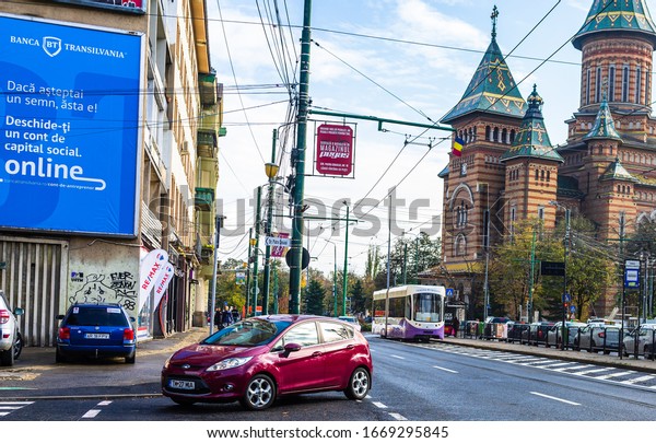 Car traffic at rush hour in downtown area of the\
city. Car pollution, traffic in the morning and evening in\
Timisoara, Romania, 2020.