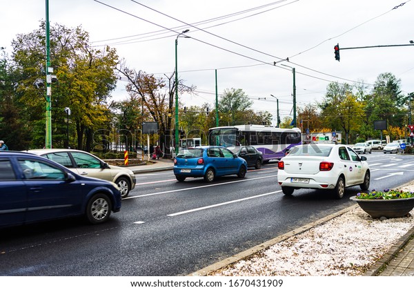 Car traffic at rush hour in downtown area of the\
city. Car pollution, traffic in the morning and evening in\
Timisoara, Romania, 2020.