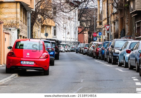 Car traffic at\
rush hour in downtown area of the city. Car pollution, traffic jam\
in Bucharest, Romania, 2022