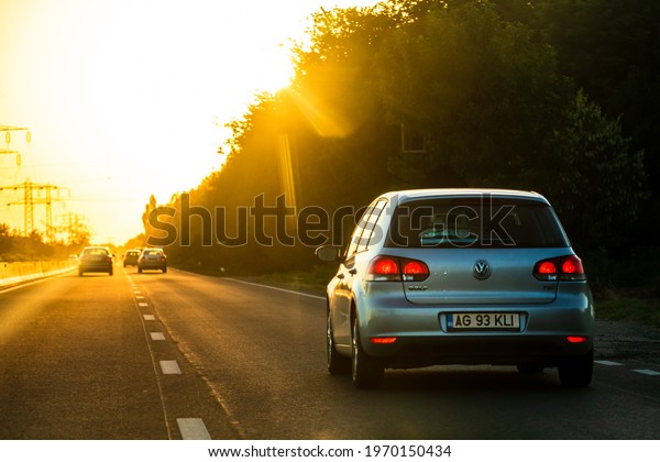 Car traffic at rush hour.\
Traffic jam, cars on the road at sunset in Bucharest, Romania,\
2021
