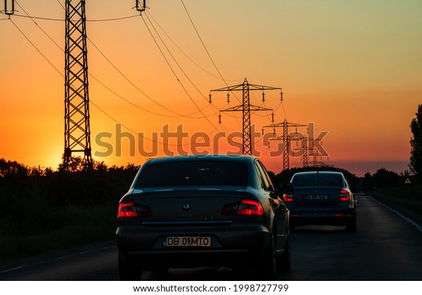 Car traffic at rush hour.\
Traffic jam, cars on the road at sunset in Bucharest, Romania,\
2021