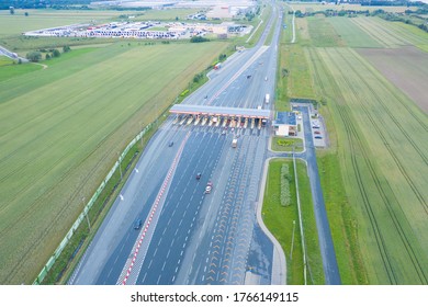 Car Traffic Transportation On Multiple Lanes Highway Road And Toll Collection Gate, Drone Aerial Top View. Commuter Transport, City Life Concept.A2 Poland Lodz