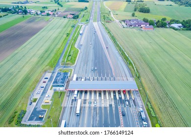 Car Traffic Transportation On Multiple Lanes Highway Road And Toll Collection Gate, Drone Aerial Top View. Commuter Transport, City Life Concept.A2 Poland Lodz