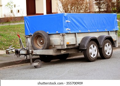 Car Trailer With Blue Tarp