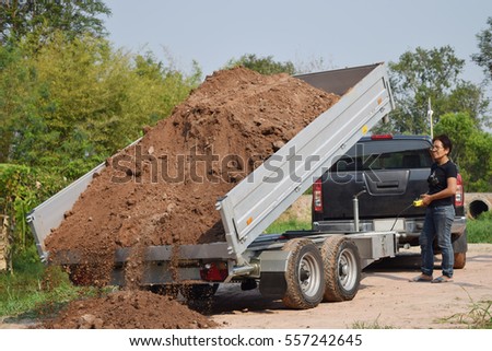 car trailer dumping.