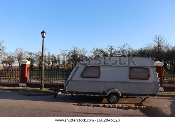 car trailer at parking\
spot in park