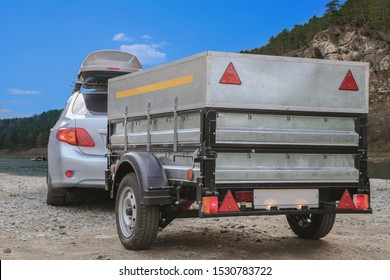 Car trailer and roof rack by the river