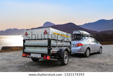 Car trailer and roof rack by the sea