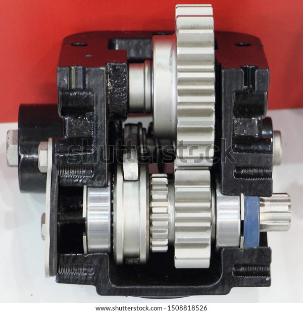 Car transmission\
spur gears with connetcion coupling in gearbox close up, wehicle\
ger spare parts and repair