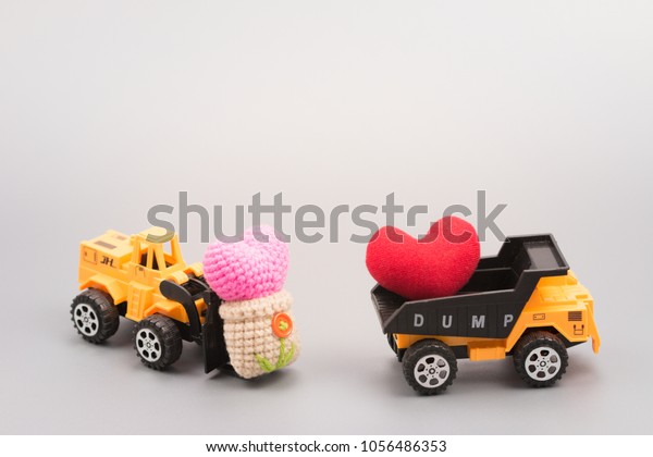 Car transport of heart pink knitting yarn in heart
shape. 