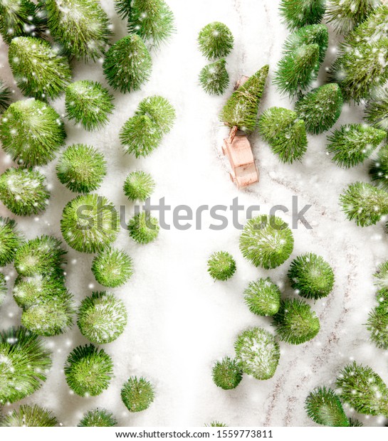 Car transporting a\
tree in a forest covered with snow. Christmas concept. White space\
for the text.