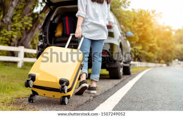 Car\
travel of woman journey with suitcase open suv car at mountain road\
and street in summer vacation road trip on holidays to destination,\
Traveler transportation vehicle people lifestyle\
