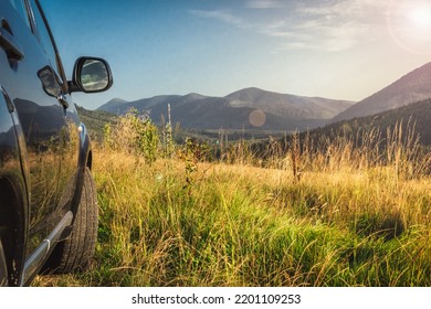 car for traveling with a mountain road. Blue sky - Shutterstock ID 2201109253