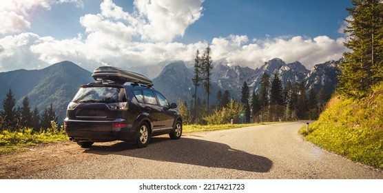 car for traveling with a mountain road. Blue sky - Shutterstock ID 2217421723