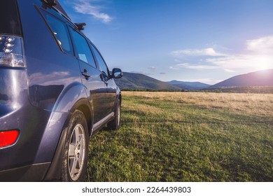 car for traveling with a mountain road. Blue sky - Shutterstock ID 2264439803