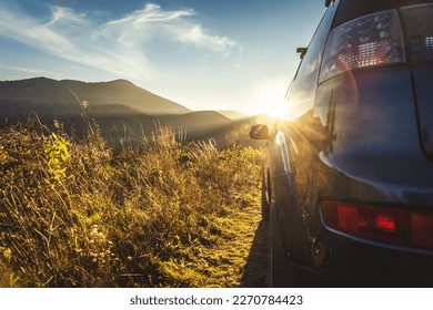 car for traveling with a mountain road. Blue sky and sun - Shutterstock ID 2270784423