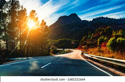 Car Travelling And Scenic Desert Road.Adventures And Destination Concept.Country Road Background And Colorful Sunset Landscape.