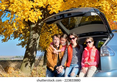 Car Trip On Autumn Family Vacation, Happy Parents And Kids Travel And Have Fun, Car Insurance Concept 