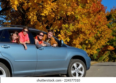 Car Trip On Autumn Family Vacation, Happy Parents And Kids Travel And Have Fun, Car Insurance Concept 